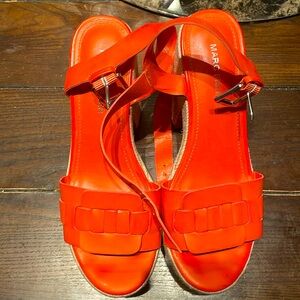 These heels are orange the name is MARC Fisher size 8 in women